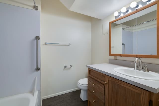 Bathroom with vanity and mirror