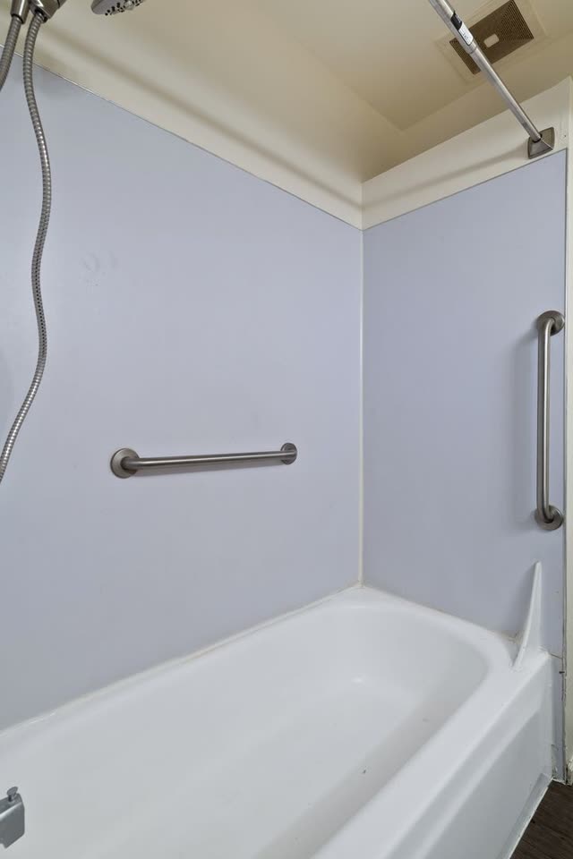 Shower with grab bar